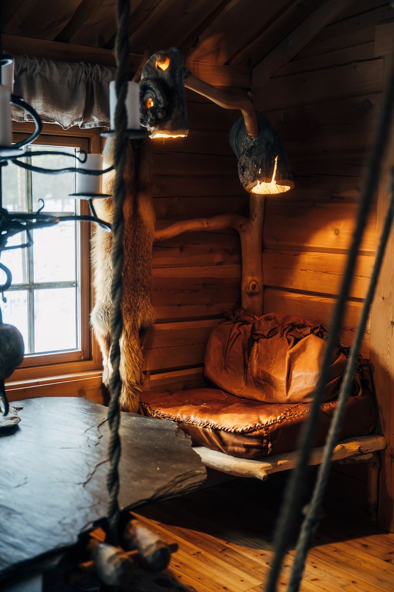 A leather hanging chair in the corner of the room