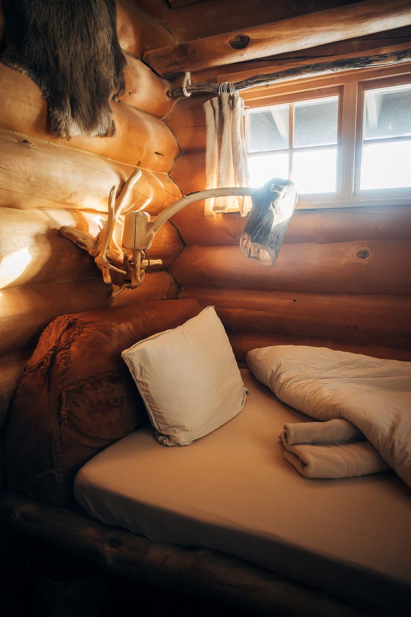 A day bed with cushions and a reindeer hide