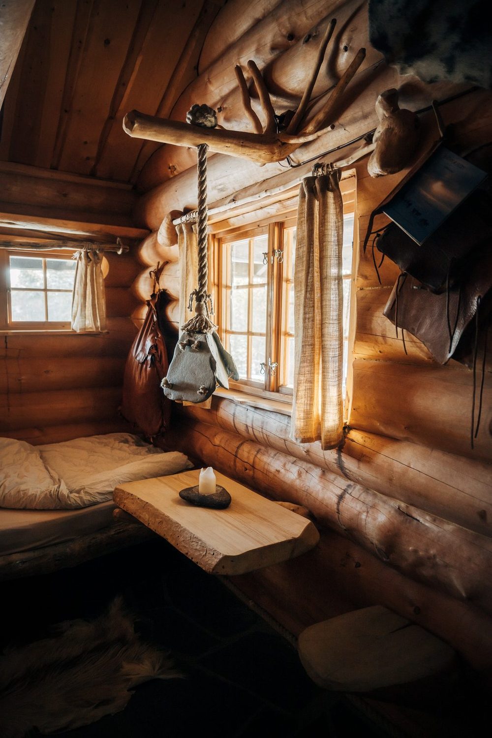 The corner by the window with a table and bench of whole timber