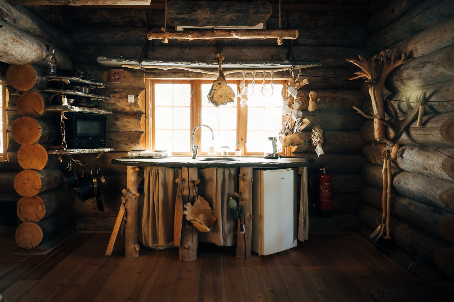 The kitchen along the log wall