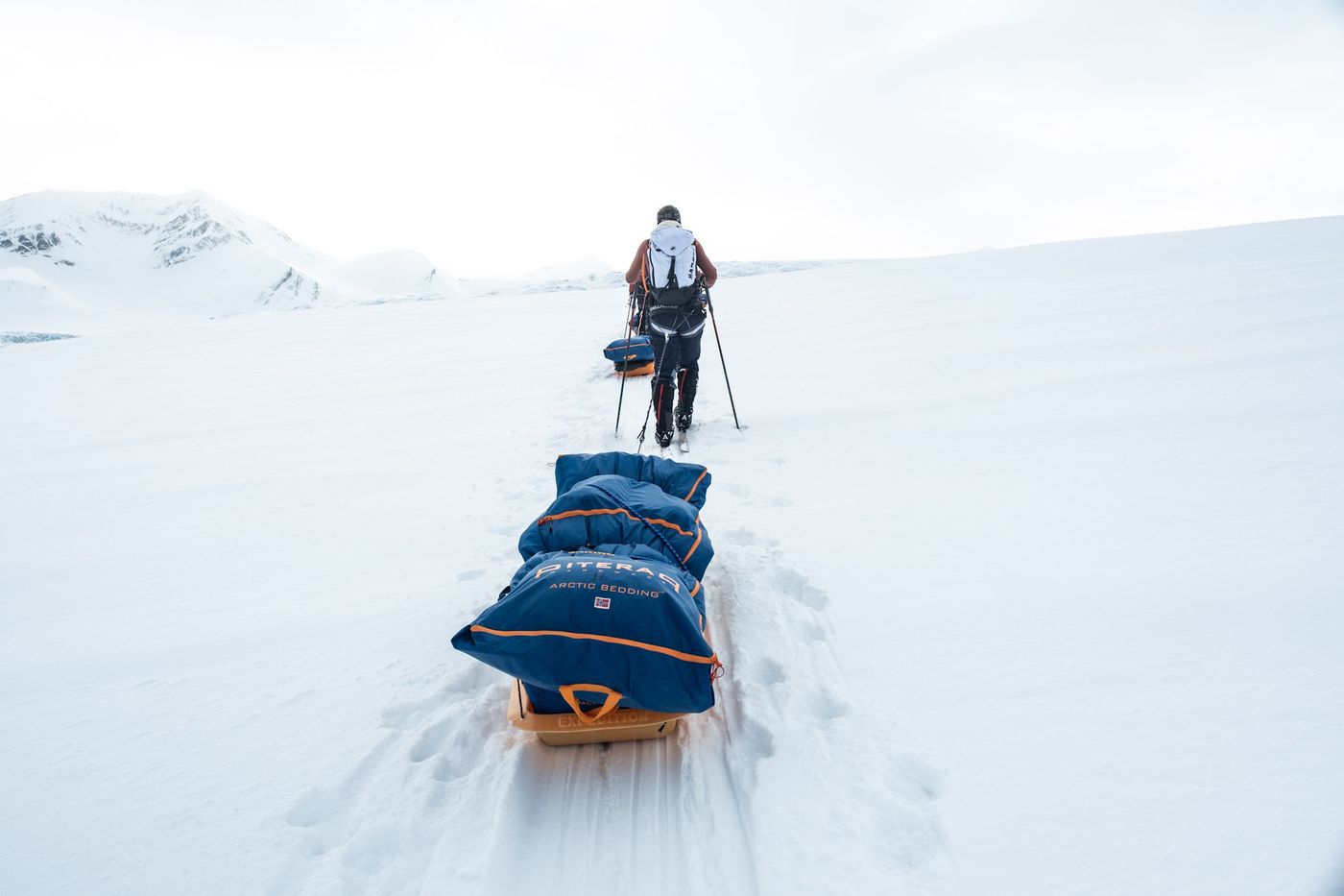 On the way, polar sled aka pulk, with sleeping system on top