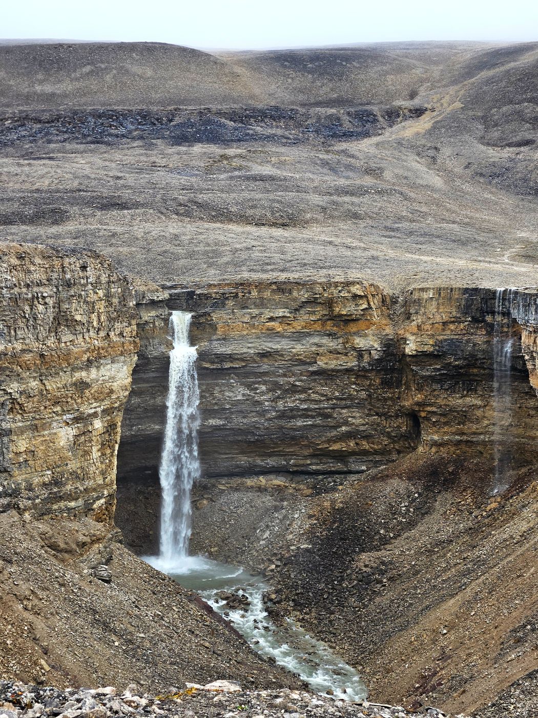 Approximately 50 meters high waterfall in Pyramiden area