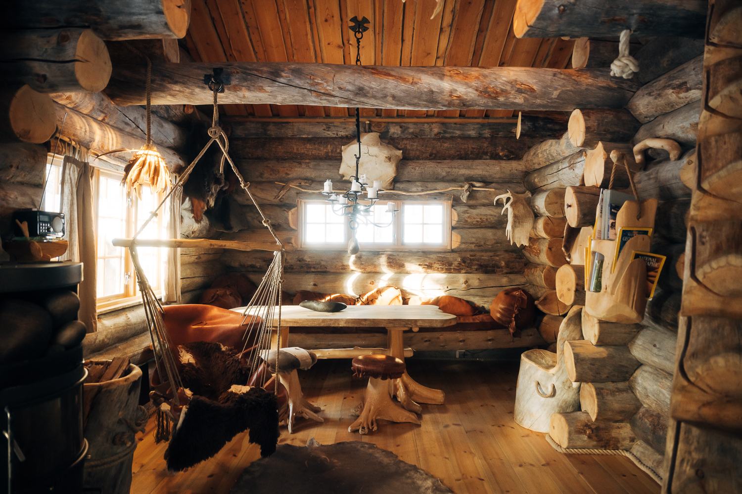 Low sun through the window of a log room