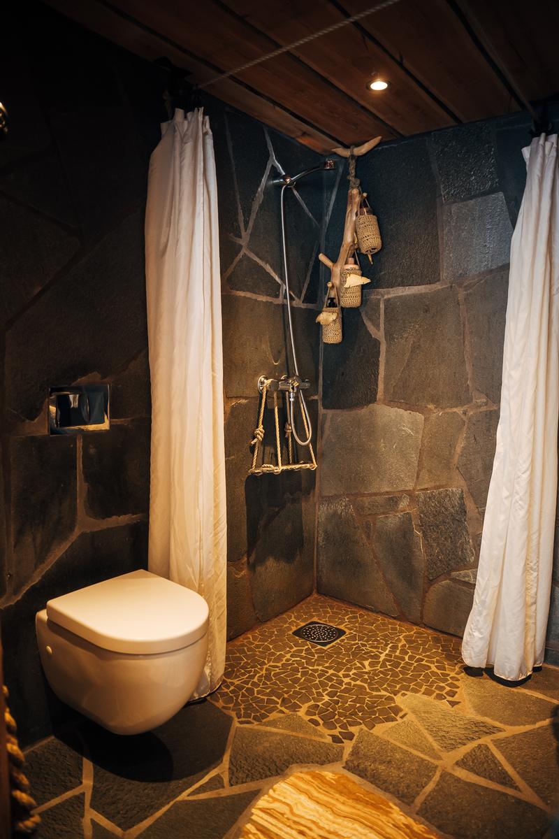 Bathroom built from slate with a stone floor